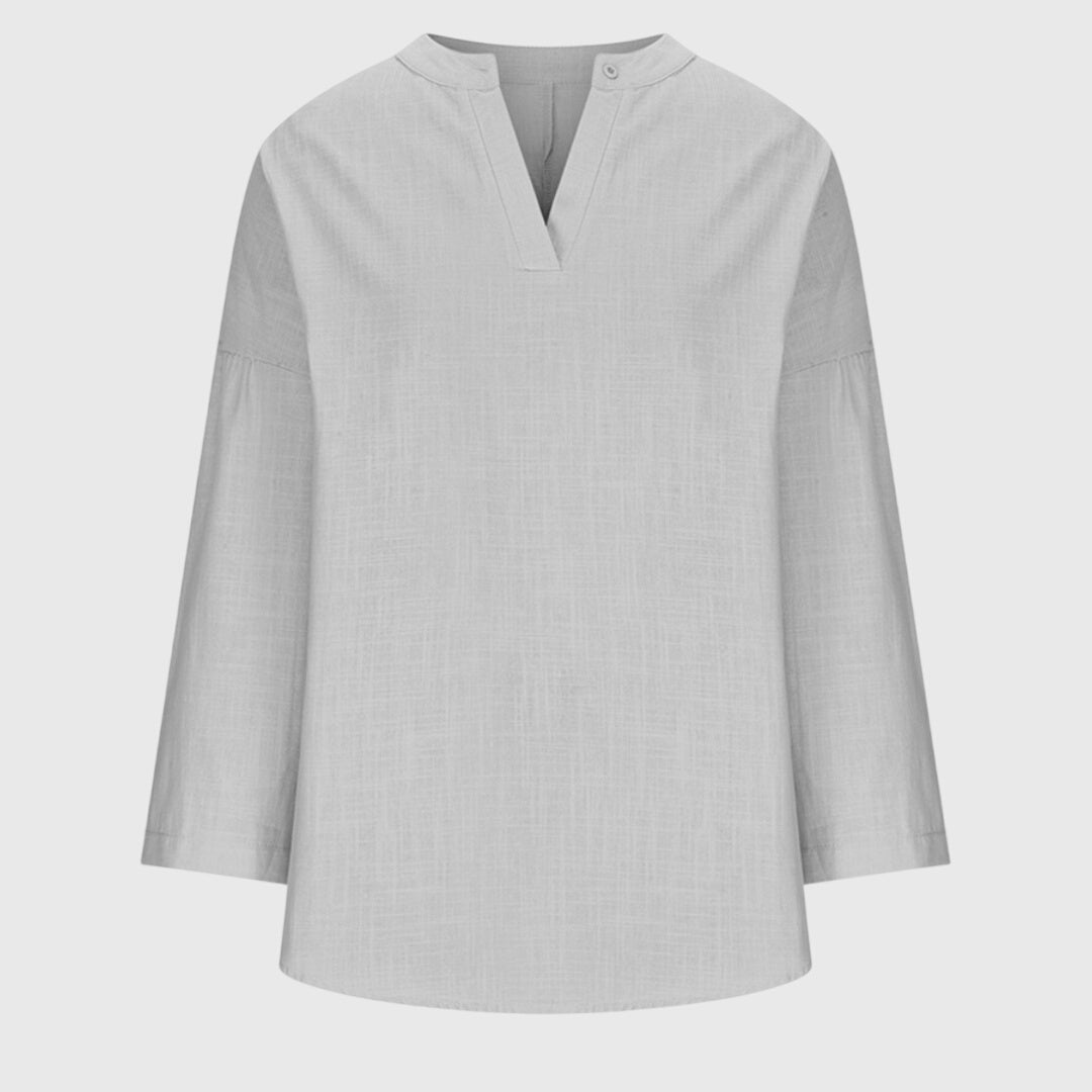 Vêtement de plage femme : chemise fluide et polyvalente, manches longues, parfaite pour l'été et les vacances.