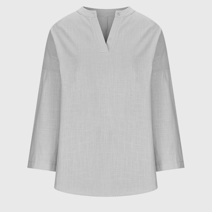 Vêtement de plage femme : chemise fluide et polyvalente, manches longues, parfaite pour l'été et les vacances.