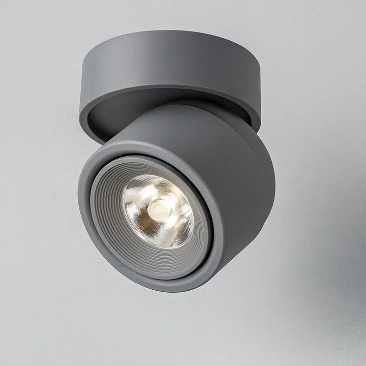 Spot LED design orientable, en aluminium, pour plafond. Apportez une lumière moderne et ajustée à votre intérieur.
