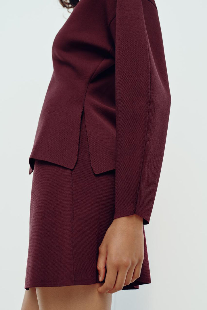 Ensemble femme deux pièces polyvalent en tricot, jupe et cardigan, confort élégant garanti.