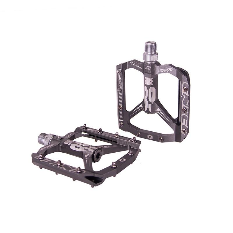 Pédales vélo VTT antidérapantes ultralégères en aluminium, conception plate pour une adhérence maximale en cyclisme.