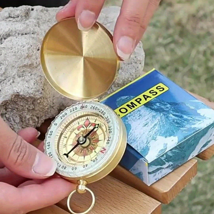 Boussole de survie en cuivre massif, étanche et luminescente, outil essentiel pour l'aventure.