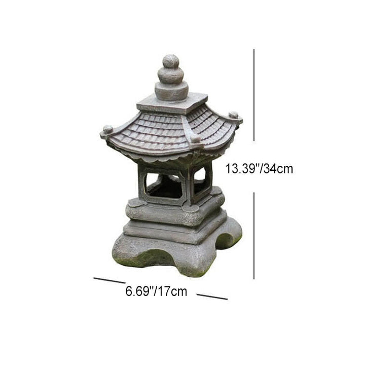 Pagode solaire LED en pierre pour jardin, crée une atmosphère zen et sereine en extérieur.