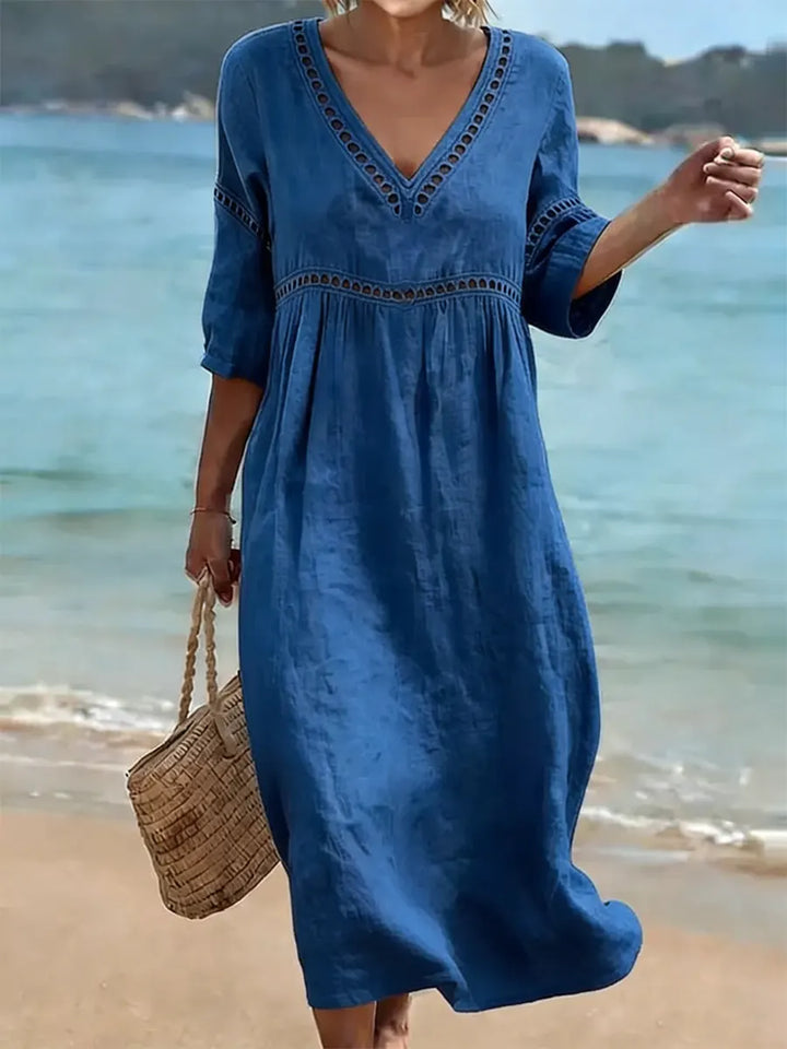 Robe femme en coton doux, col V, coupe fluide mi-longue. Style décontracté élégant pour toute occasion.