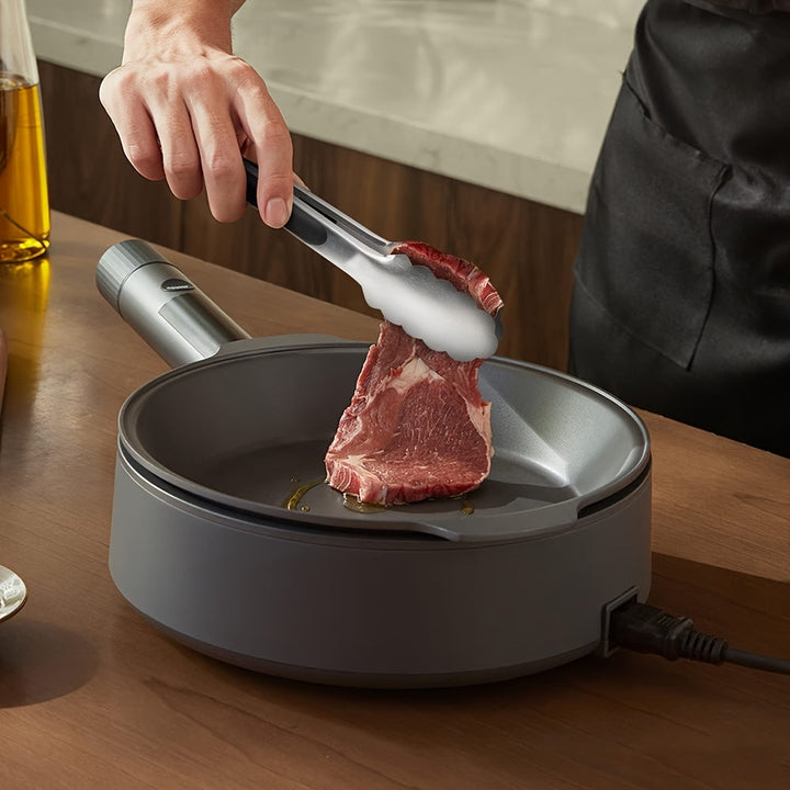 Pinces de précision en inox avec embouts silicone, conçues pour manipuler facilement les aliments chauds au grill.