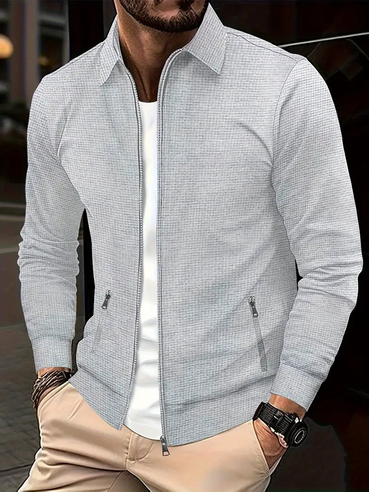 Veste de transition homme, style moderne et zippé. Vêtement polyvalent et élégant pour automne et printemps.