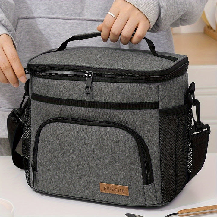 Sac isotherme gris pour repas frais toute la journée. Organisation facile pour bureau, école, pique-nique. Transport confortable.