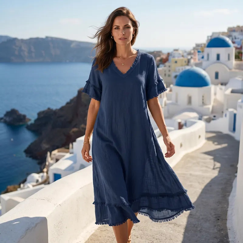 Robe femme bohème fluide avec col V et franges. Style casual chic, parfaite pour le printemps, l'été et les vacances.