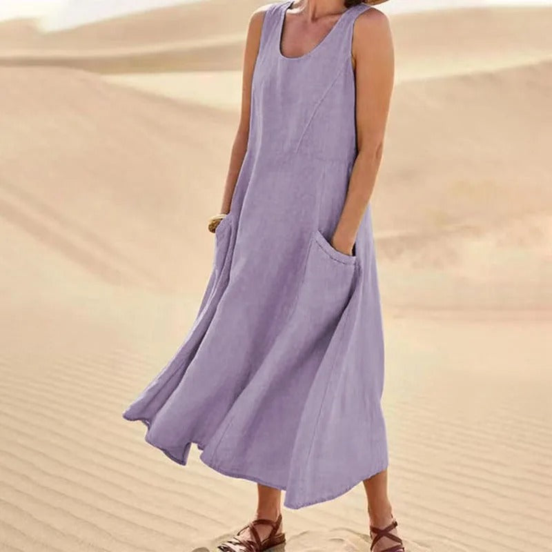 Robe femme maxi fluide sans manches, moderne et confortable, idéale pour un usage quotidien en été ou au printemps.