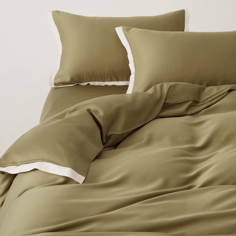 Ensemble complet de literie Tencel patchwork luxueux, comprenant housse et taies pour une chambre élégante.