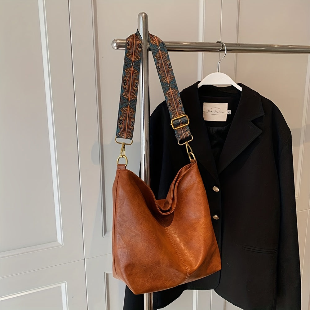 Sac femme mode géométrique, bandoulière ajustable, grand volume, look rétro intemporel.