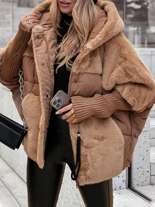 Femme en veste matelassée tendance, marchant en ville. Style décontracté et protection hivernale.