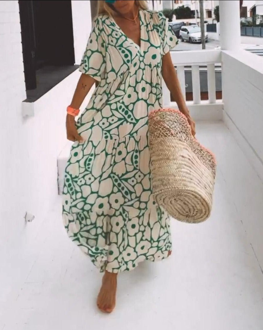 Robe femme longue vert crème à imprimé floral, idéale pour l'été et les vacances. Style décontracté chic, manches volantes.