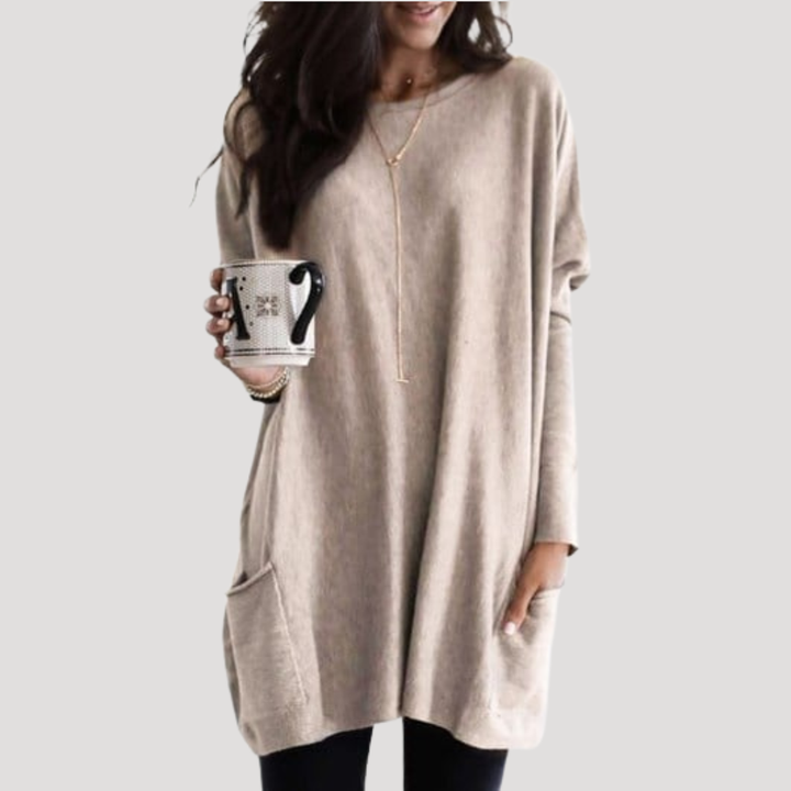 Pull femme long avec motif géométrique distinctif, parfait pour l'automne et des looks casual modernes.