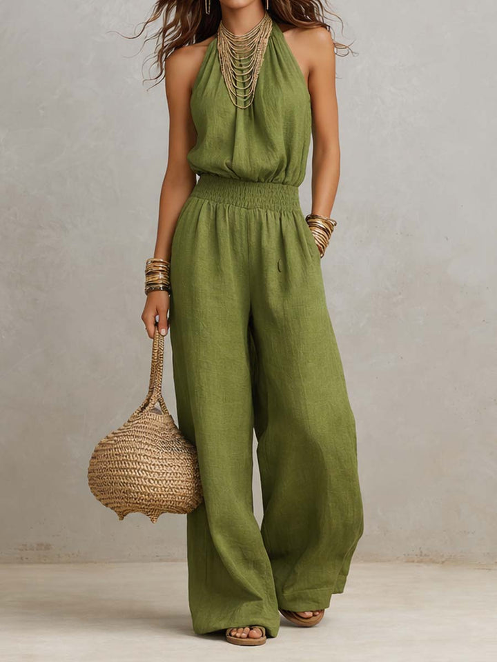 Combinaison fluide femme halter élégante à jambes larges. Idéale pour un été chic et décontracté.