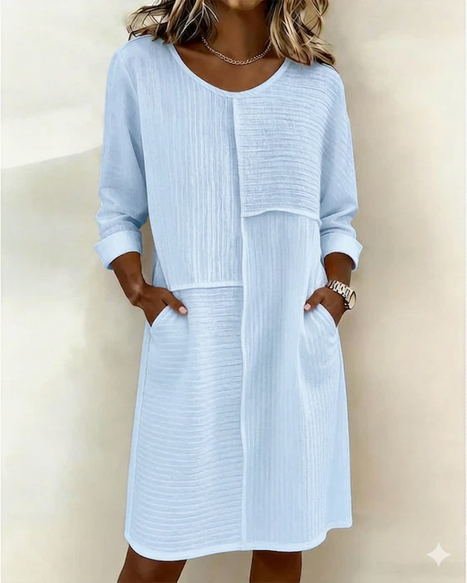 Détail de la texture coton lin d'une robe fluide femme. Élégante et confortable, style printemps-été polyvalent.