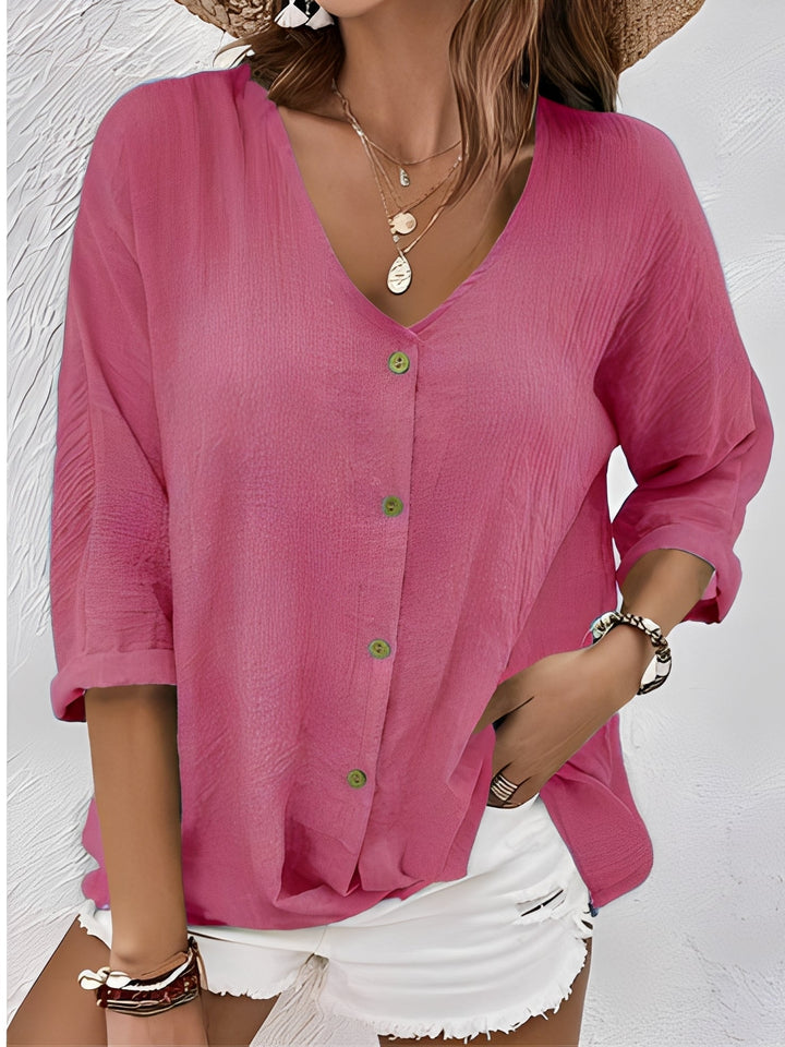 T-shirt basique femme col V, coupe élégante et décontractée. Idéal pour un look polyvalent d'été.
