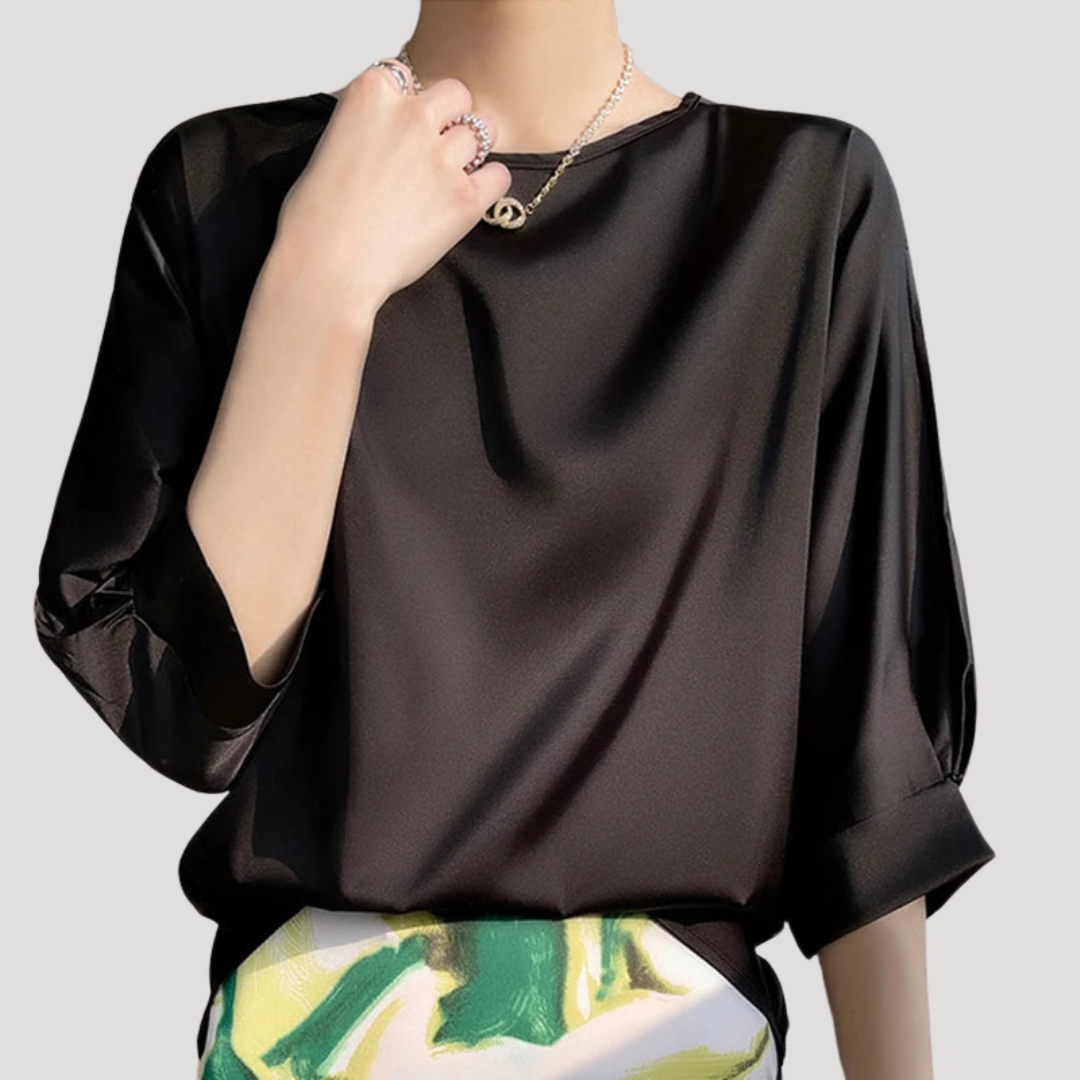 Top femme élégant, col rond, manches 3/4. Style décontracté chic, idéal pour mode printemps-été.