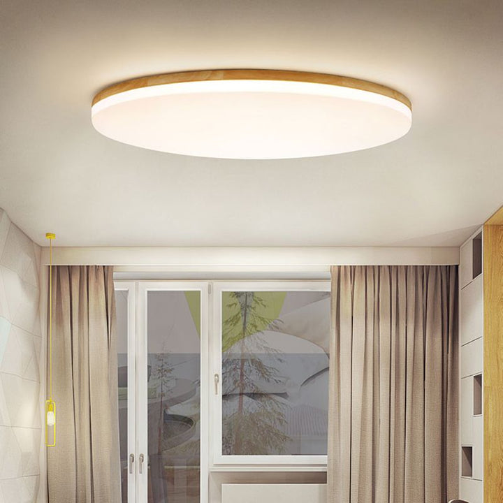 Luminaire LED moderne pour chambre, lumière douce et design contemporain.