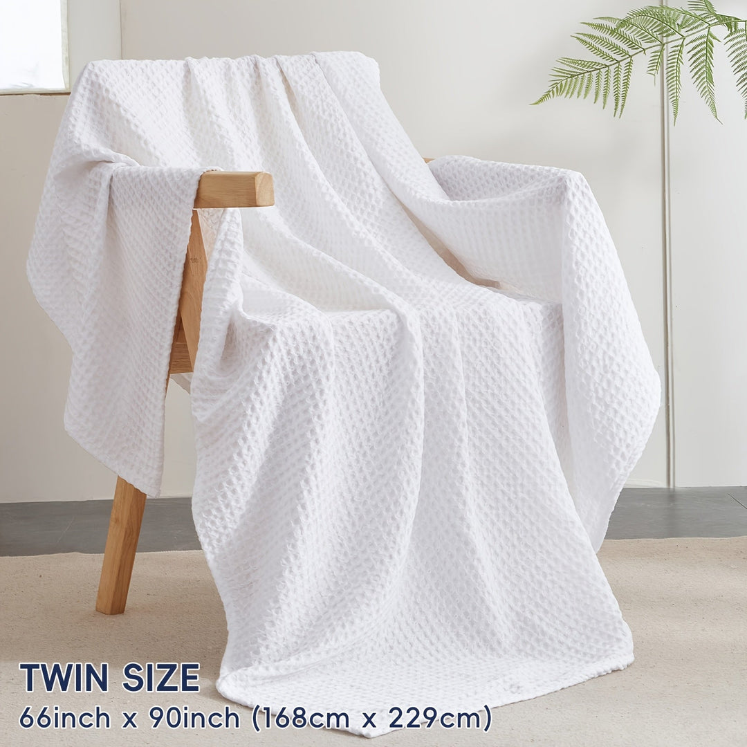 Couverture Cloudweave ultra douce, texture gaufrée unique, apporte chaleur et style à votre intérieur.