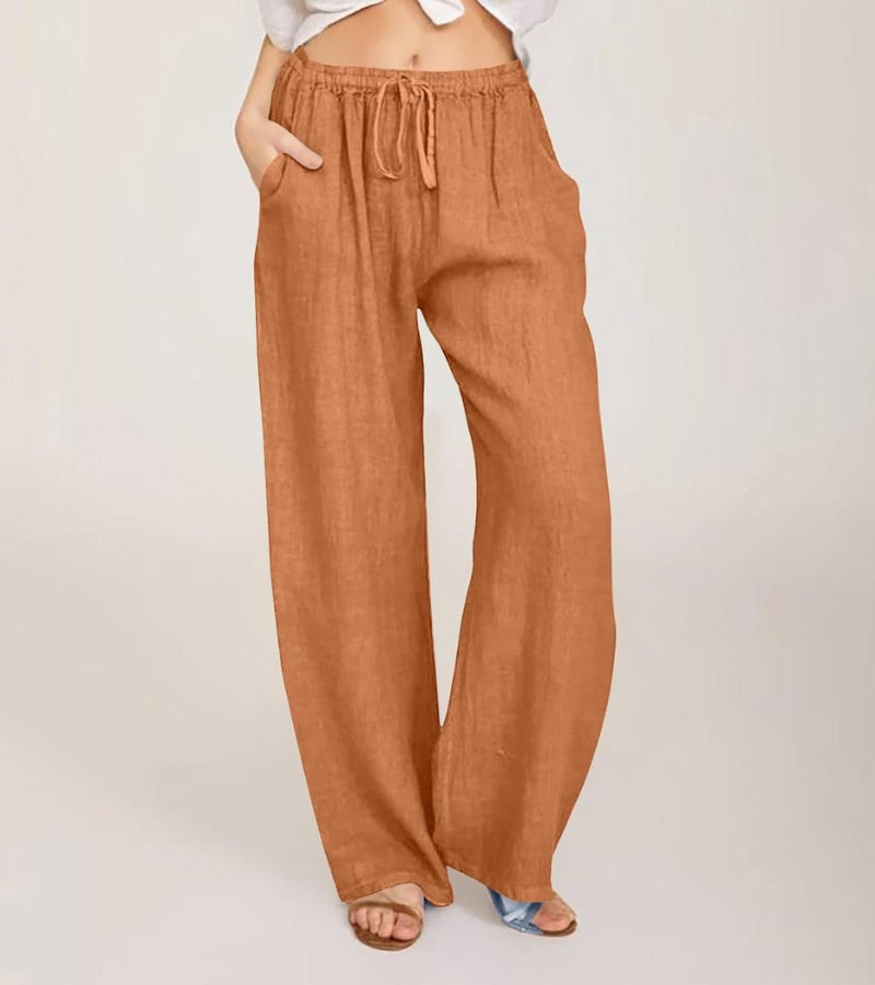 Pantalon large femme taille haute en lin, idéal pour un look estival décontracté et confortable.