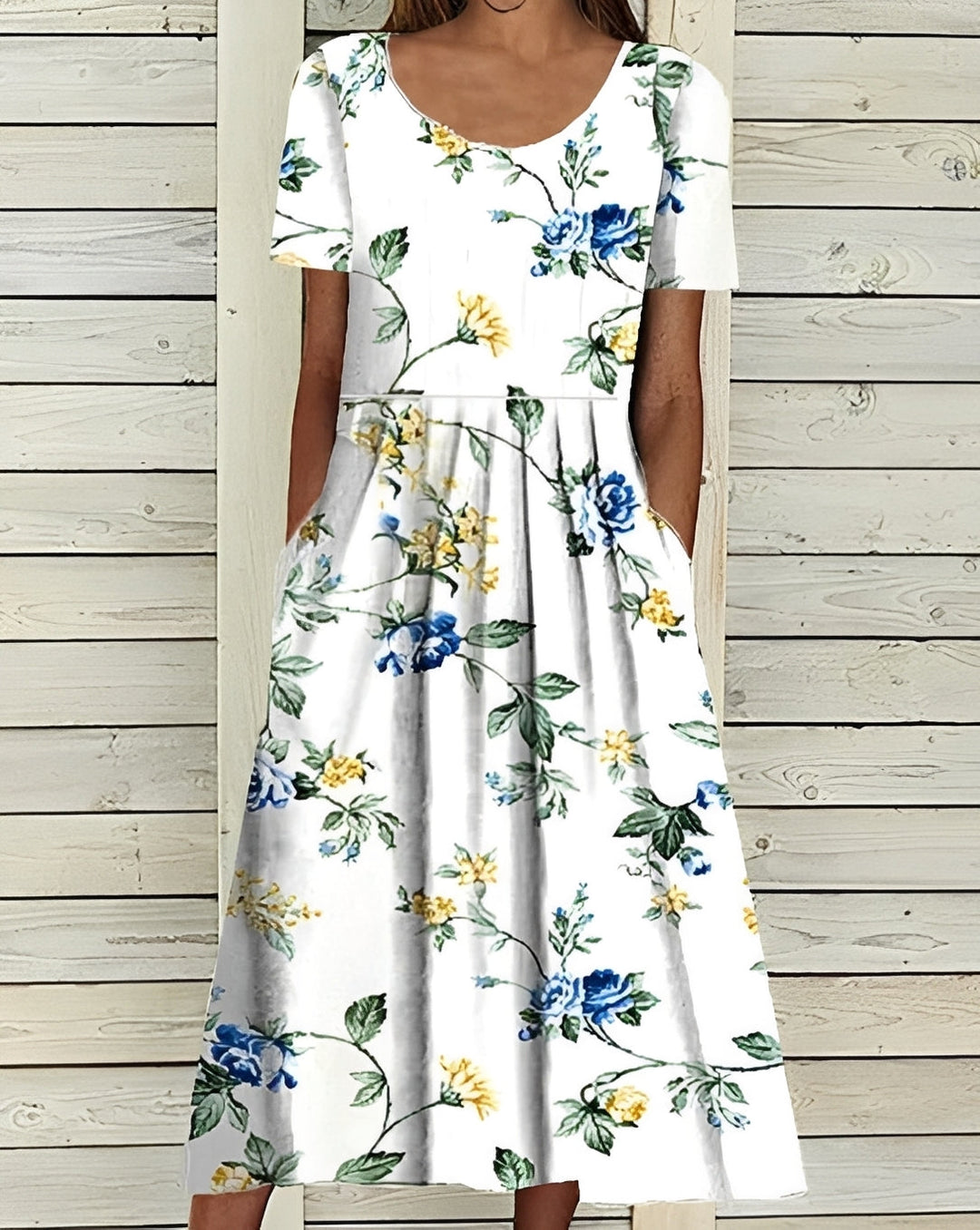 Robe midi fluide à imprimé floral, style féminin chic et confortable pour le printemps.
