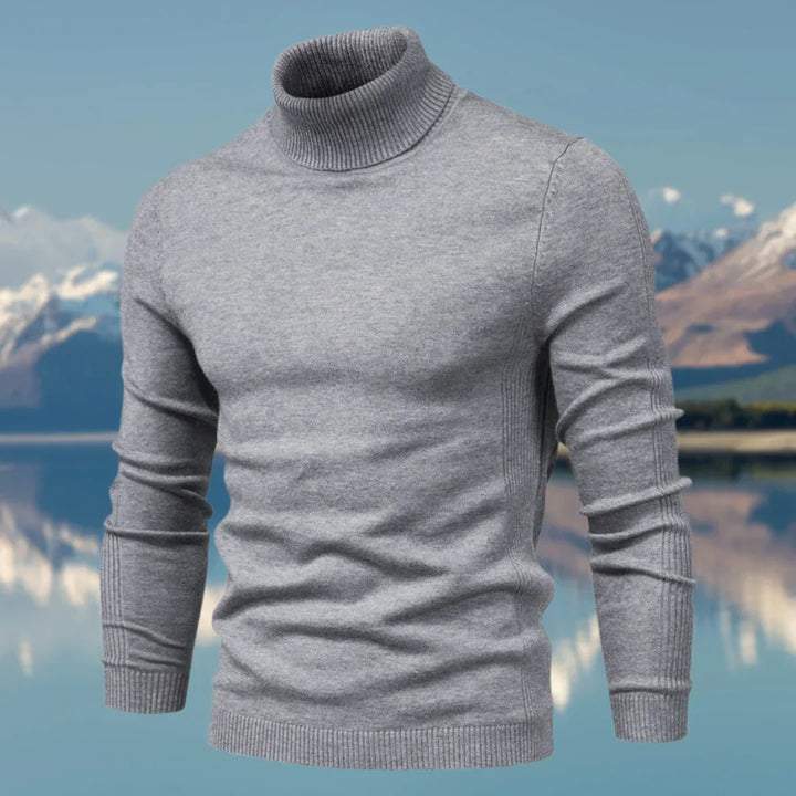 Pull col roulé homme bleu marine, classique et ajusté, idéal pour affronter le froid avec style.