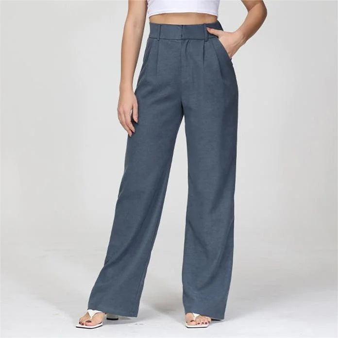 Pantalon tendance femme, jambe large et taille haute. Vêtement de bureau moderne, confortable, pour un style féminin chic.