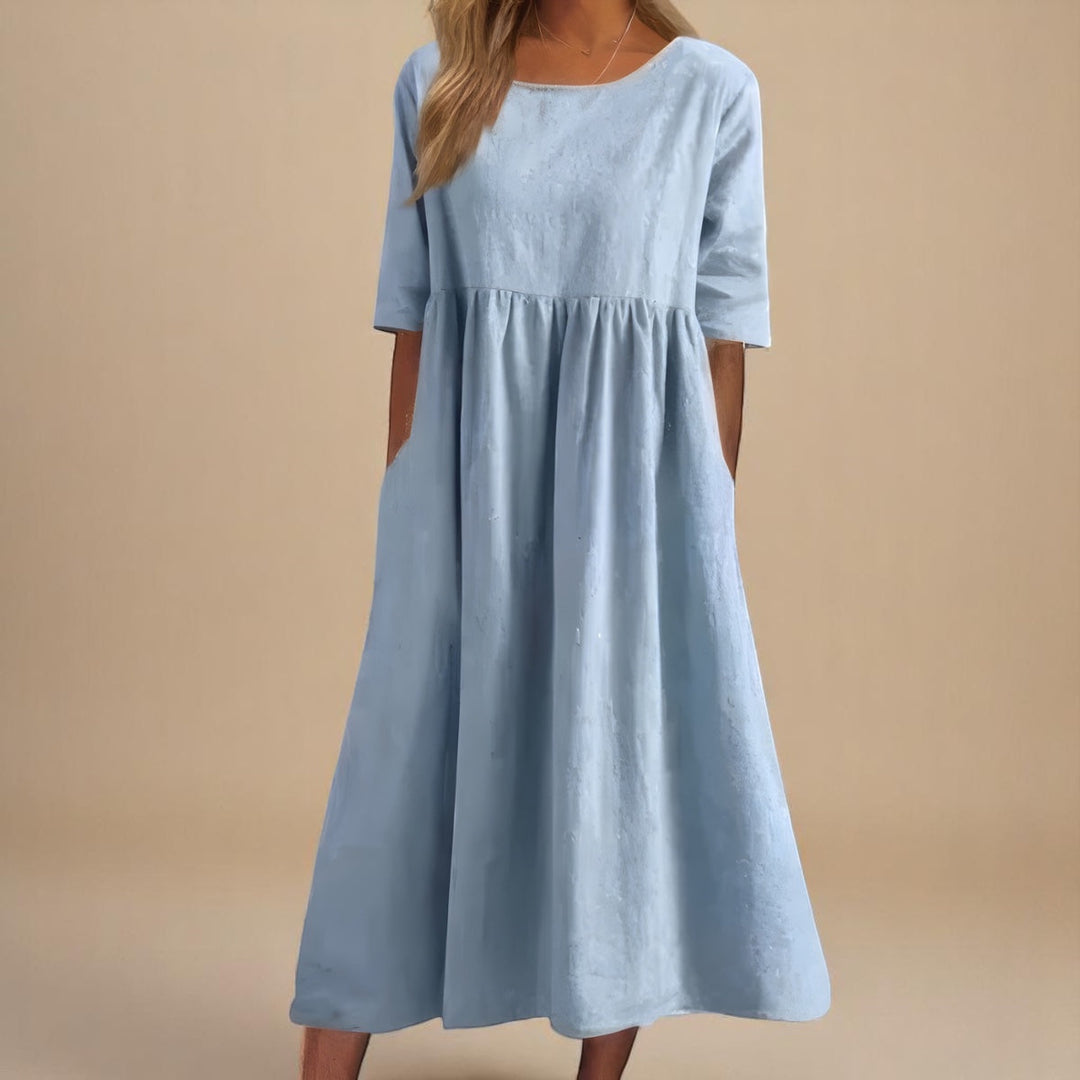 Détail des poches pratiques d'une robe longue femme en coton ample, style décontracté estival.