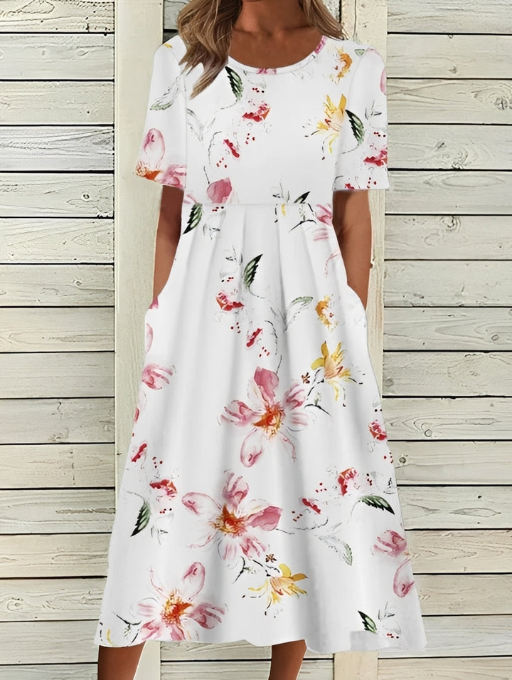 Robe midi fleurie élégante pour femme, style printanier fluide et confortable.
