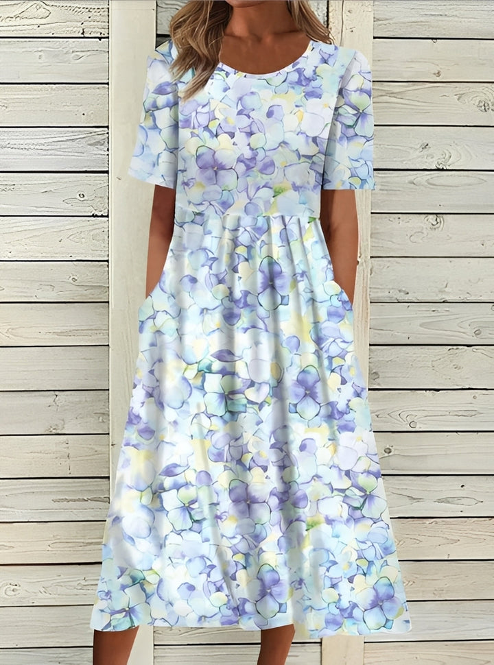 Robe midi fleurie femme, confortable et élégante, parfaite pour le printemps.
