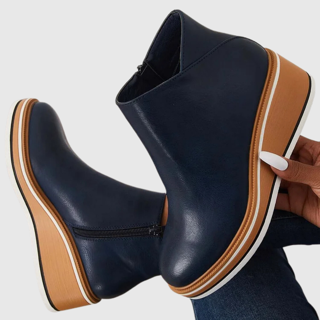 Bottes femme noires, style moderne, silhouette élancée. Confort quotidien garanti pour une allure élégante.