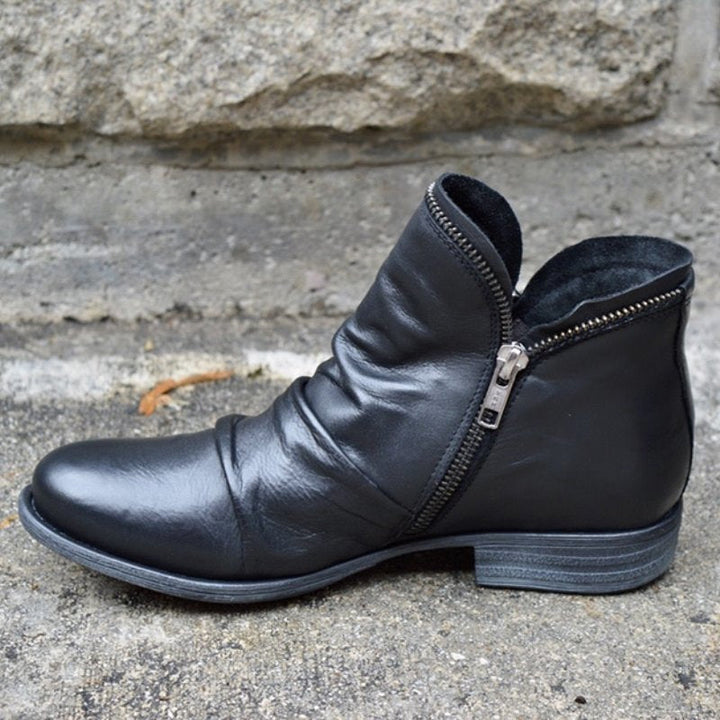 Bottines femme élégantes, avec fermeture éclair. Tendance et chic, idéales pour vos tenues d'automne-hiver.