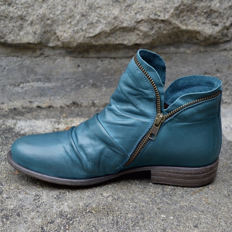 Bottines noires femme, design moderne avec zip. Confortables et mode, parfaites pour la saison froide.