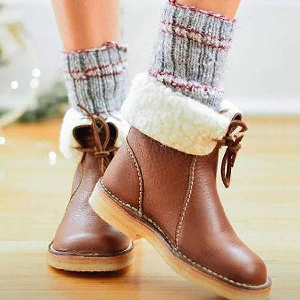Bottes hivernales femme imperméables, chaudes et élégantes, assurant confort optimal par temps froid.