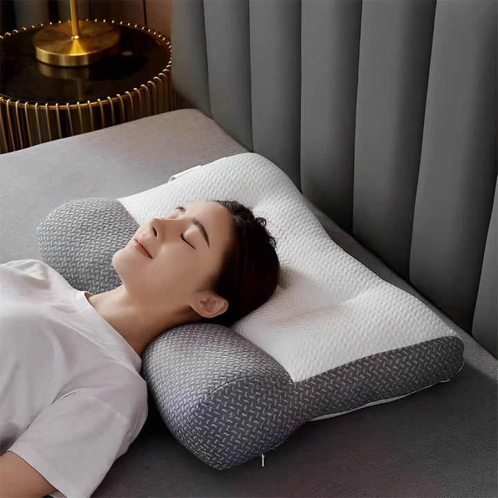 Coussin ergonomique mémoire de forme gris, idéal pour le soutien de la nuque et le soulagement des douleurs cervicales.
