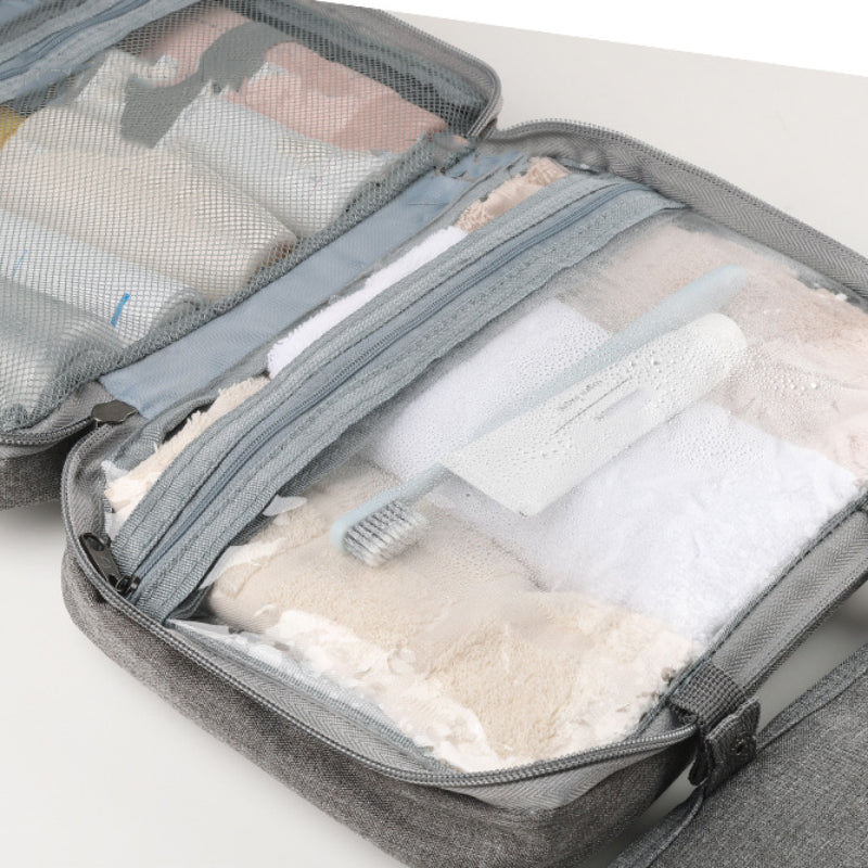 Trousse de toilette unisexe et portable, optimisant l'espace dans vos bagages de voyage.