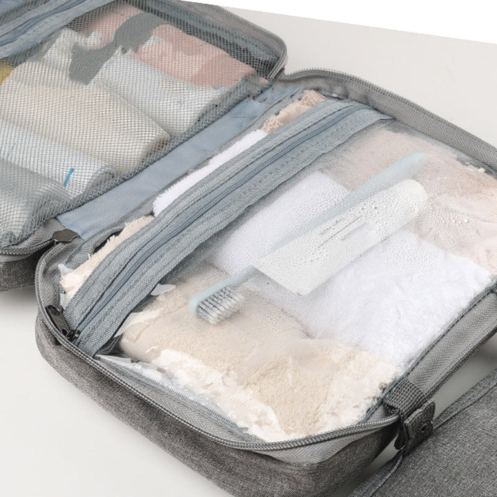 Trousse de toilette unisexe et portable, optimisant l'espace dans vos bagages de voyage.
