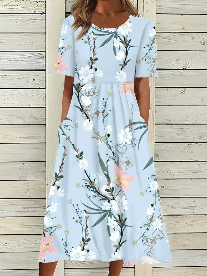 Robe midi femme décontractée et chic, motif floral, parfaite pour l'été.