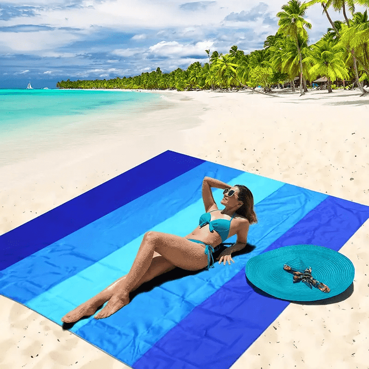 Grande serviette de plage imperméable et légère. Idéale pour la plage, le camping ou le pique-nique en extérieur.