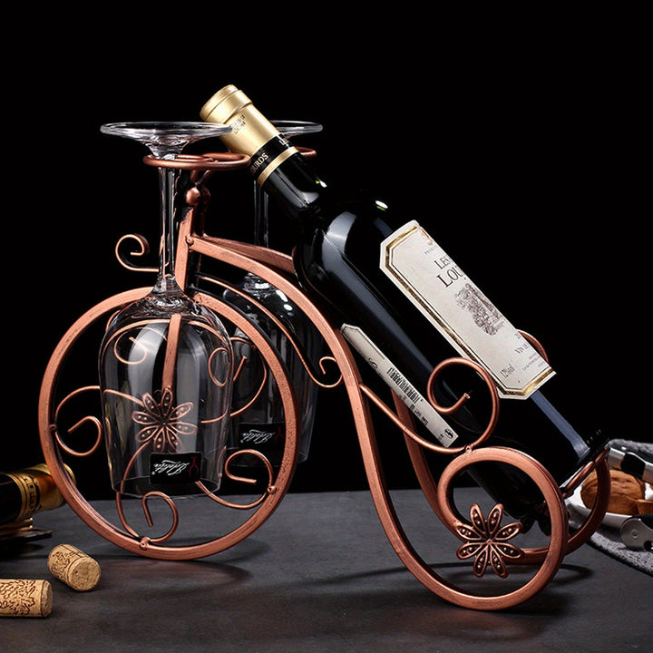 Support de vin décoratif en forme de vélo, en métal bronze. Idéal comme porte bouteille original pour salon et bar.