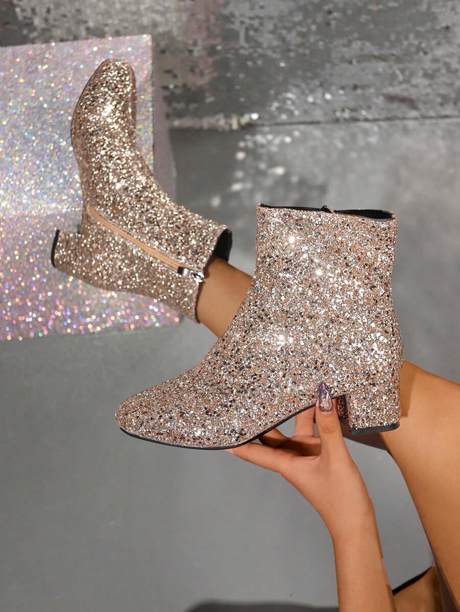 Bottines Marini brillantes pour femmes, bout pointu élégant, idéales pour un look mode hivernal.