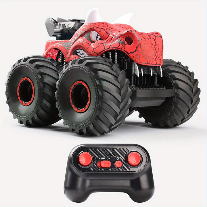 Monstertruck RC DinoBlaze rouge en pleine cascade, avec fumée, lumières LED. Véhicule tout-terrain télécommandé puissant.