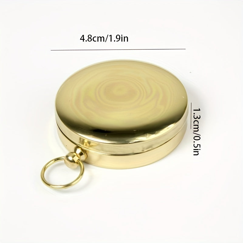 Boussole de survie portable en cuivre, étanche et luminescente, essentielle pour l'orientation.