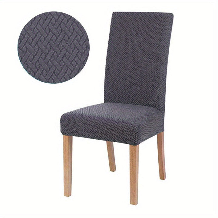Housse de canapé jacquard grise, extensible. Apporte confort et protection élégante à votre salon moderne.