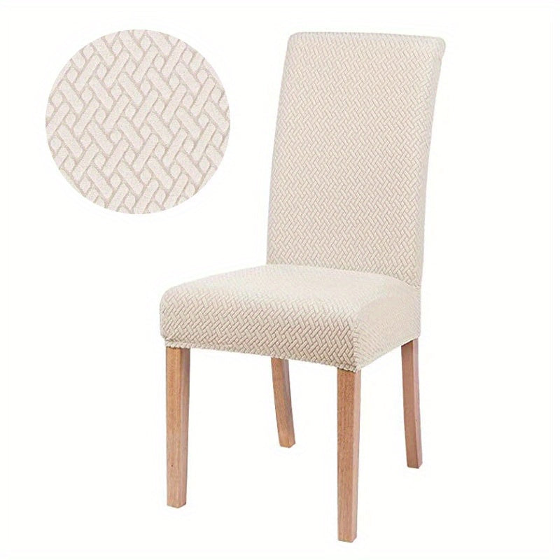 Protection de canapé élastique verte. Housse confortable et élégante pour un salon protégé et moderne.