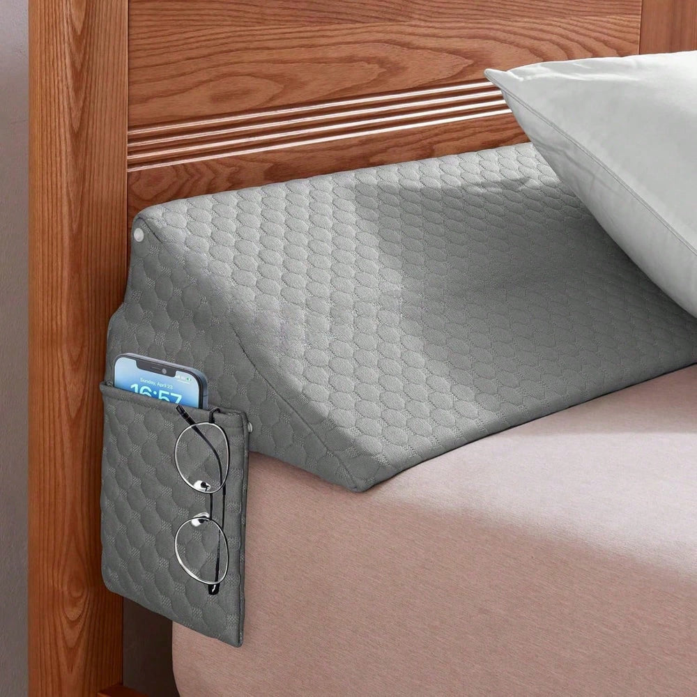Coussin de lit RESTBRIDGE avec poches latérales, parfait pour organiser et éviter les objets perdus dans l'espace du lit.