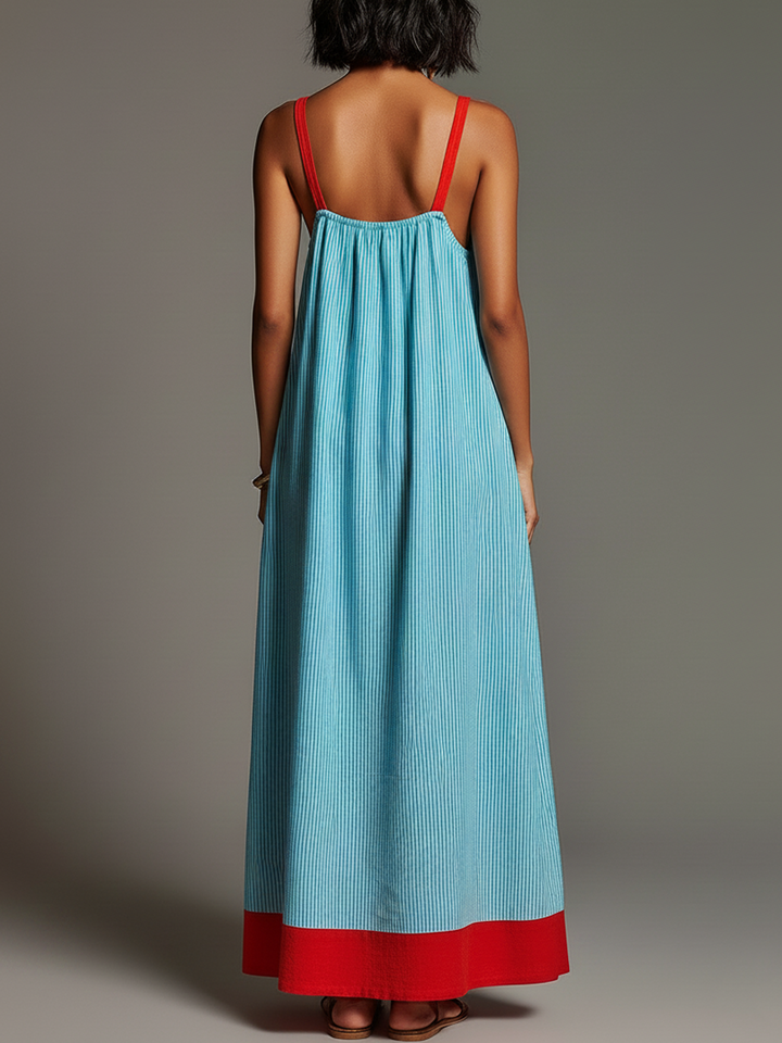 Robe longue femme estivale rayée avec poches, bretelles fines. Parfaite pour les vacances et le confort d'été.