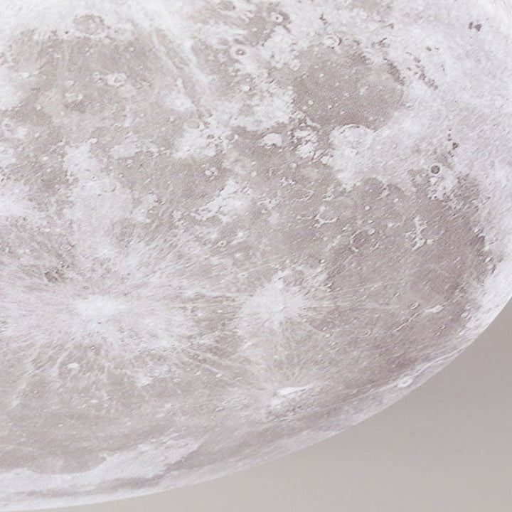 Plafonnier LED lune 3D, lumière douce et économe pour créer une ambiance confortable.