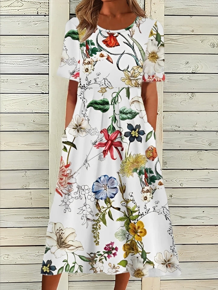 Robe fleurie printemps-été femme, coupe midi, à la fois élégante et décontractée.